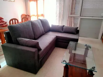 a living room with a couch and a glass table at apartamento en Puerto Real in El Trocadero