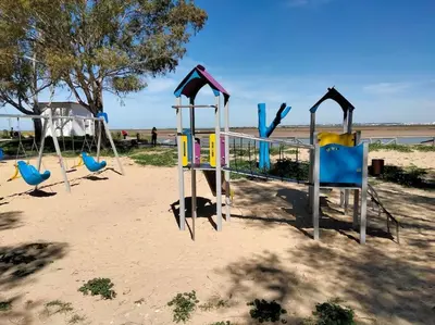 a group of playground equipment in the sand at apartamento en Puerto Real in El Trocadero