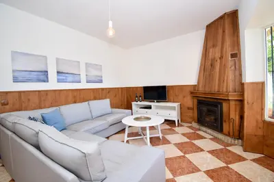 a living room with a couch and a fireplace at Del Sol 18 in Chiclana de la Frontera