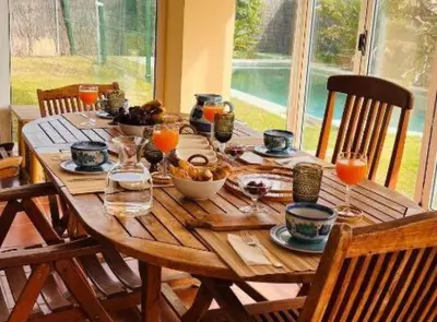 a wooden table with food and drinks on it at Chalet Puerto Sherry in El Puerto de Santa María