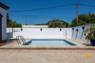 a small swimming pool in a white wall at Frambuesa by Cádiz Time in Chiclana de la Frontera