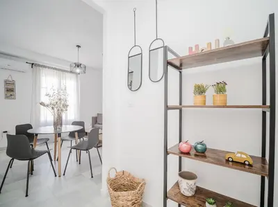 a dining room with a table and chairs at Sibs Sanlucar Altamar Nuevo Centrico Tranquilo in Sanlúcar de Barrameda