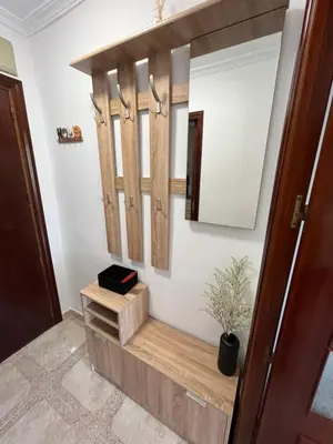 a dressing room with wooden doors and a mirror at Piso en Cadiz para Verano in Cádiz