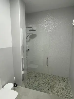 a bathroom with a shower and a toilet at Apartamento María Sanlúcar con garaje in Sanlúcar de Barrameda