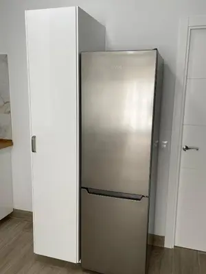 a stainless steel refrigerator in a white room at Apartamento María Sanlúcar con garaje in Sanlúcar de Barrameda