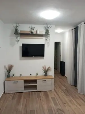 a living room with a flat screen tv on a wall at La parada in El Puerto de Santa María