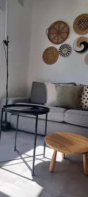 a living room with a couch and a table at Casita de diseño cerca del mar in El Puerto de Santa María