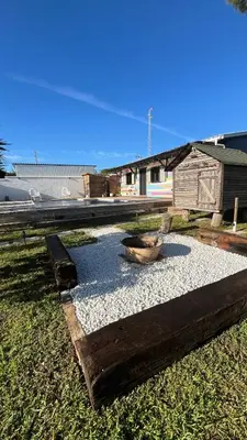 a garden with a bowl on top of gravel at La Casita in Cuartillos