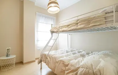 a bedroom with a bunk bed with a ladder at Nice Home In Arcos De La Frontera in Arcos de la Frontera