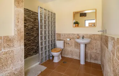 a bathroom with a toilet and a sink at Nice Home In Arcos De La Frontera in Arcos de la Frontera