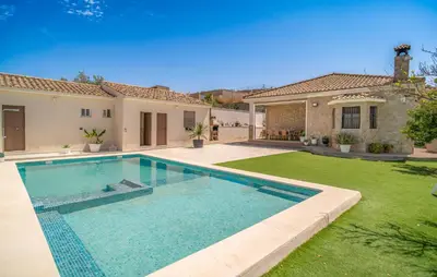 a swimming pool in the yard of a house at Nice Home In Arcos De La Frontera in Arcos de la Frontera