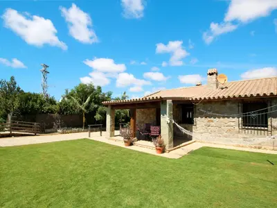 a house with a lawn in front of it at Holiday Home De Piedra by Interhome in Conil de la Frontera