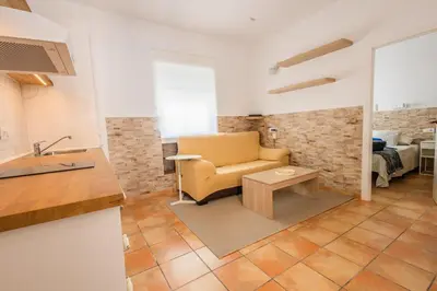 a living room with a couch and a table at GuestReady - Calvario Rota 30 JC in Rota