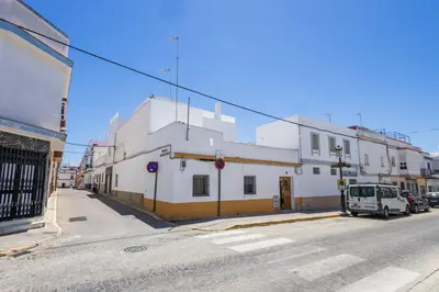 a white building on the side of a street at GuestReady - Calvario Rota 30 JC in Rota