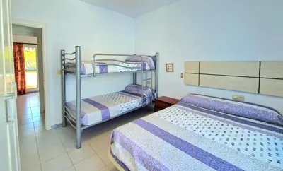 a room with two bunk beds in a room at La almadraba in Chiclana de la Frontera