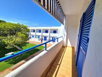 a balcony with a view of a building at La almadraba in Chiclana de la Frontera