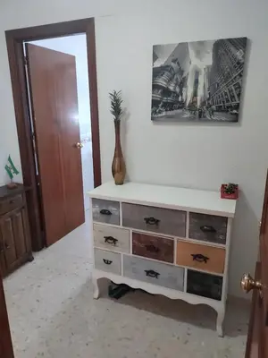 a dresser with a mirror in a room at High Sanlúcar-Aparcamiento incluído in Sanlúcar de Barrameda