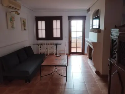 a living room with a couch and a table at Apartamentos Jasmund - Estudio 0 in San Fernando
