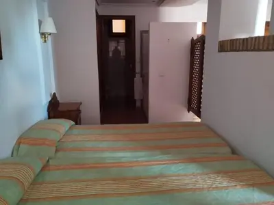 a bedroom with a large bed in a room at Apartamentos Jasmund - Estudio 0 in San Fernando