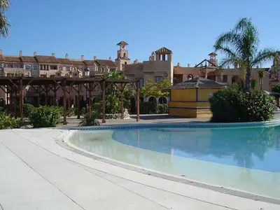 a large swimming pool in front of a building at Apartamentos Jasmund - Estudio 0 in San Fernando