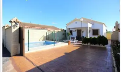 a backyard of a house with a swimming pool at Casa rural 1 in Conil de la Frontera