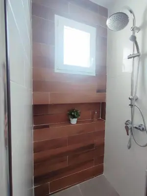 a bathroom with a shower and a window at Apartamentos Muñoz Fornell 2 in Chiclana de la Frontera