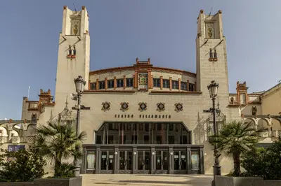 a large building with two towers on top of it at Allo Apartments Medina Duplex Parking 3 Habitaciones in Jerez de la Frontera