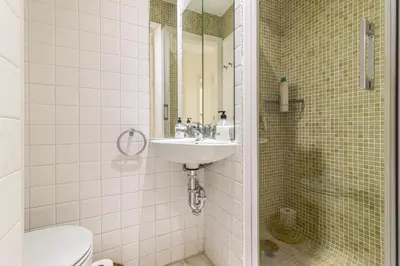 a bathroom with a sink and a toilet at Allo Apartments Medina Duplex Parking 3 Habitaciones in Jerez de la Frontera