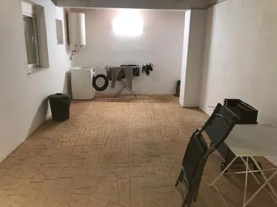 a room with a camera and a table and chairs at Vivienda con piscina Jacuzzi in Chiclana de la Frontera