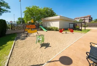 a playground with two swings and a swing at Lola9 in Sanlúcar de Barrameda