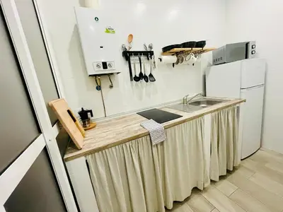 a kitchen with bowls and utensils on a wall at Casa Moderna in Jerez de la Frontera