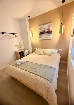 a bedroom with a large bed in a room at Casa Moderna in Jerez de la Frontera