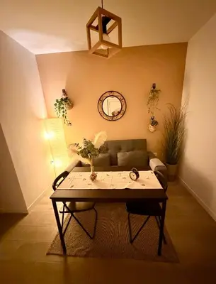 a room with two beds and a mirror at Casa Moderna in Jerez de la Frontera