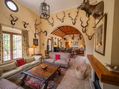 a living room with a couch and a table at Casa Rancho el Marques fjhomefj in Jerez de la Frontera