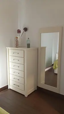 a white dresser with a mirror in a room at Finca Rural Marmito in Sanlúcar de Barrameda