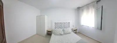 a white room with white walls and a window at Casa Andrea in Puerto Real