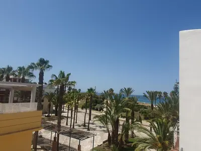 a view of the beach from the balcony of a resort at Bogavante Costa Ballena in Rota