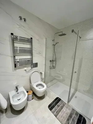 a bathroom with a shower and a toilet and a sink at Costa Ballena & Eleven Lights in Chipiona