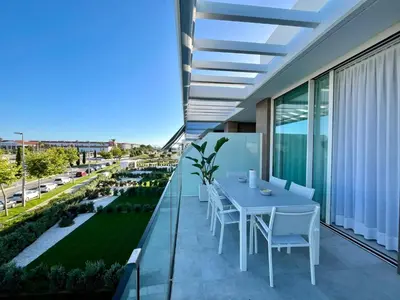 a balcony with a table and chairs on it at Costa Ballena & Eleven Lights in Chipiona