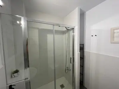 a shower with a glass door in a bathroom at Rodmar Playa Grupo AC Gestion in Cádiz