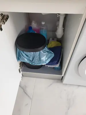 a bathroom cabinet with a sink and a toilet at Apartamento Gloria Bendita in Jerez de la Frontera