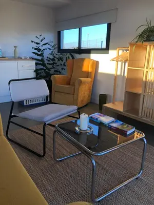 a living room with a couch and a coffee table at Casa Isabelina Stay near Doñana & the Coast in Sanlúcar de Barrameda