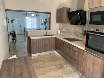 a large kitchen with a sink and a microwave at Apartamento HS Costa Castillo in Poblado de Sancti Petri