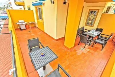 an overhead view of a patio with a table and chairs at Beachfront Duplex 1ª línea & Terraces Oceanfront in El Puerto de Santa María