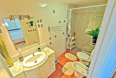 a bathroom with a sink and a shower and a toilet at Beachfront Duplex 1ª línea & Terraces Oceanfront in El Puerto de Santa María