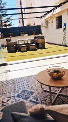 a room with a table and chairs and a patio at El Paraíso de Fuentebravía - Primera Línea de Playa in El Puerto de Santa María