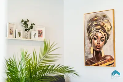 a painting of a woman on a wall at Villa Granizo C in Chiclana de la Frontera
