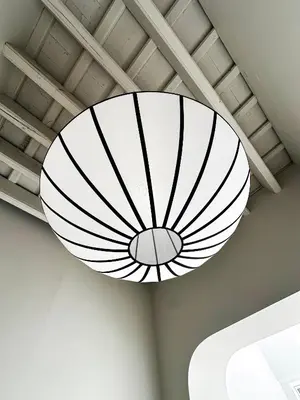 a large white light fixture hanging from a ceiling at Casa Monti - Sherry Suites A in Jerez de la Frontera