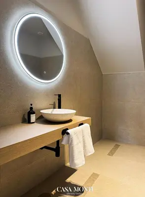 a bathroom with a sink and a mirror at Casa Monti - Sherry Suites A in Jerez de la Frontera