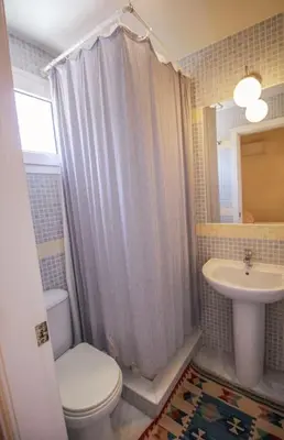 a bathroom with a toilet and a sink at Casa de lujo en Las Redes in El Puerto de Santa María